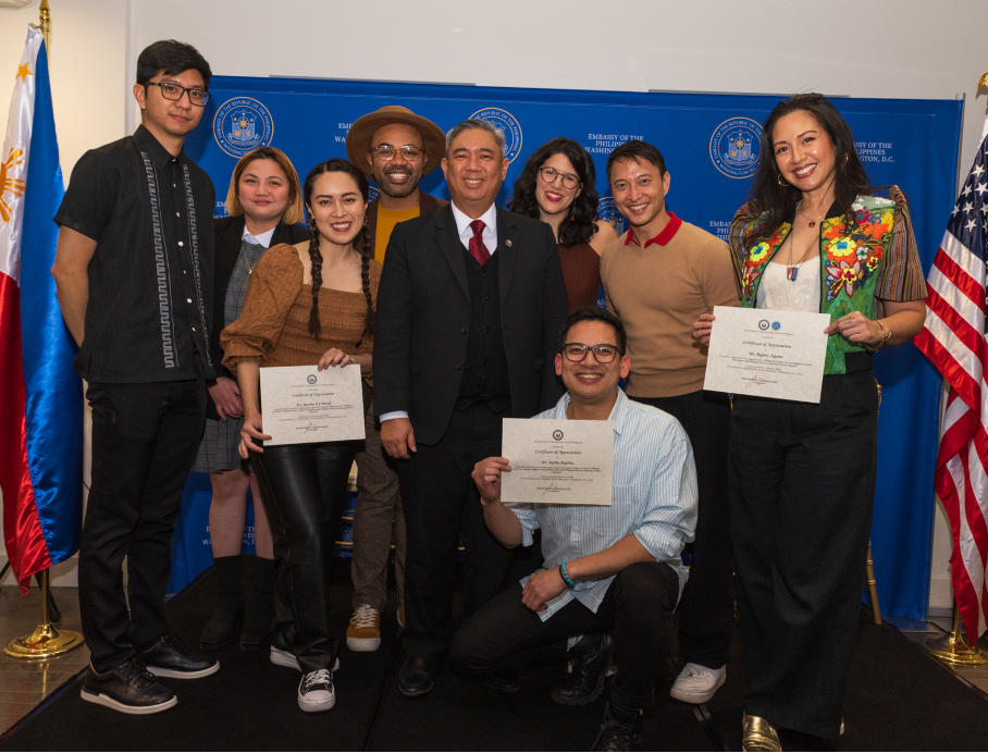 Consul General Iric Cruz Arribas (center) presents certificates of appreciation to the panel speakers and moderator. The theater makers from right to left are Ms. Regina Aquino (moderator), Mr. Joseph Pinzon, Mr. Justin Huertas (kneeling), Ms. Sally Imbriano, Mr. Raymond Caldwell, and Ms. Justine “Icy” Moral.