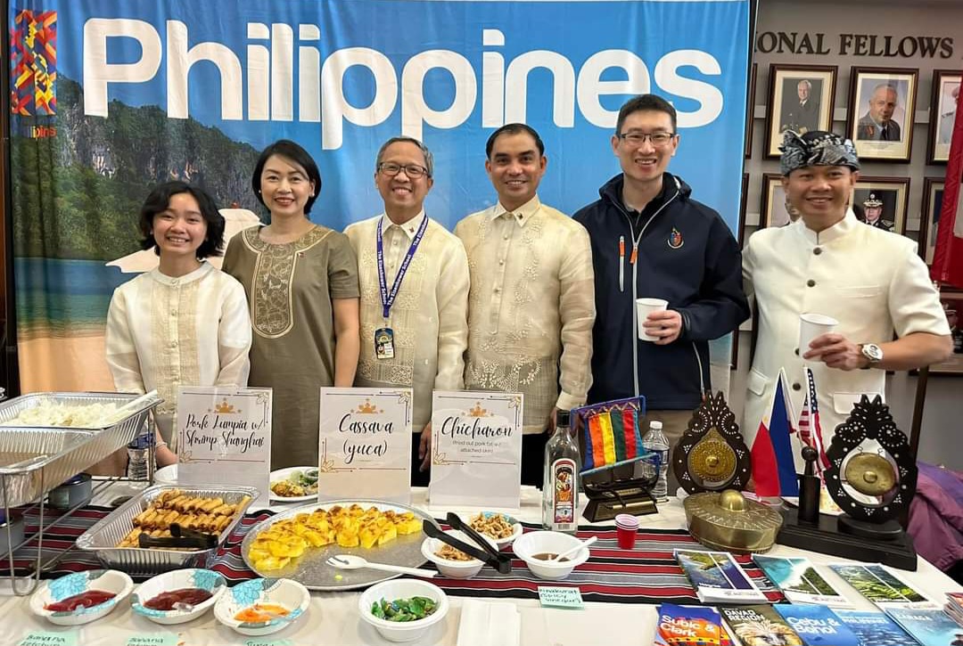 This year’s Filipino fellows - Col. Alfonso Matias (3rd from left) and Col. Justin Ramolete (4th from left) - represented and served Filipino food during the International Fellow Luncheon at the National Defense University. Col. Matias is joined by his wife and daughter, Genalin (2nd from the left) and Robyn (leftmost) (photo contributed by: Col. Justin Ramolete)