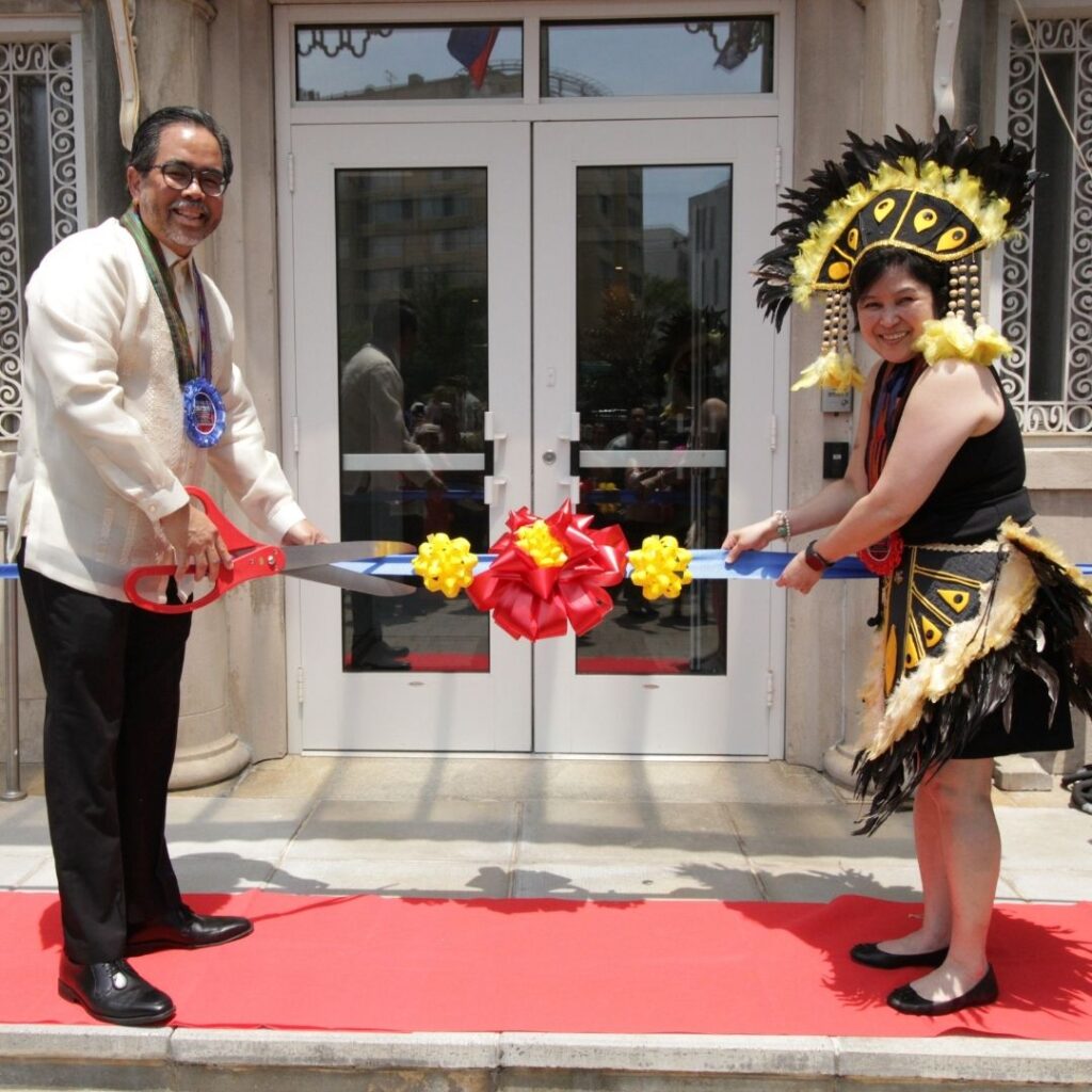 Deputy Chief of Mission Jaime Ramon Ascalon Jr. (left) and Malou Cadacio representing the Philippine Independence Day Committee (PIDC) (right) cut the ribbon for the fashion exhibit and networking event at the Chancery Annex of the Embassy