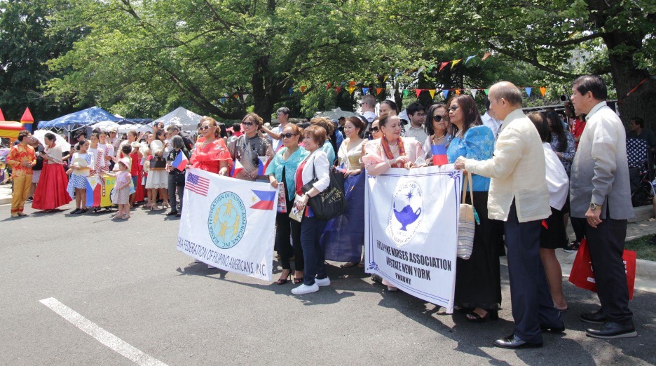 10 June 2023 - Filipino community organizations prepare their banners for the mini-parade.