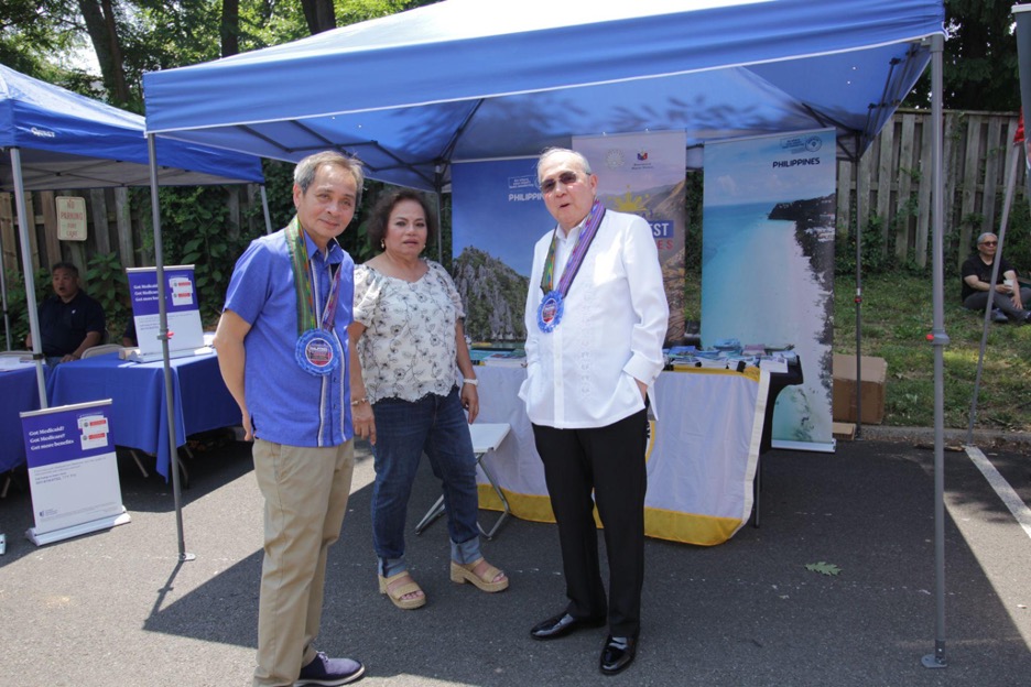 10 June 2023 - Ambassador Romualdez (right) visits PH Tourism Attache Francisco Lardizabal and the booth of the Philippine Department of Tourism during the street festival.