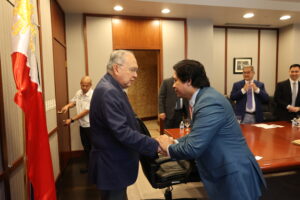 Ambassador Jose Manuel G. Romualdez (left) welcomes APECO delegates headed by PCEO Gil Taway IV (right)