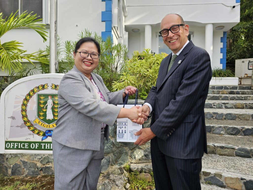 Governor Daniel Pruce receives a small token of appreciation from Consul General Donna Rodriguez after their meeting at the Governor’s Mansion on 16 August 2024.