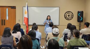 Consul Barbie Rosales gives a briefing at an oath taking ceremony during the consular outreach mission in Atlanta, Georgia, where 132 individuals reacquired their Philippine citizenship.