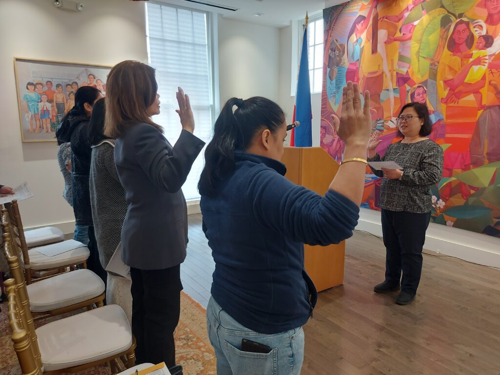 Consul General Donna Rodriguez (right) administers the oath of allegiance during the Special Saturday Consular Service for women on 15 March 2025.