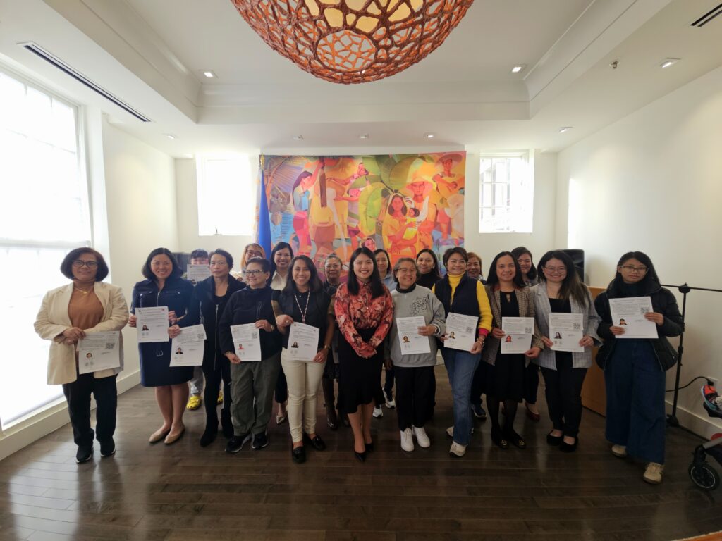 The newly sworn-in dual citizens proudly display their identification certificates alongside Consul Barbie Rosales (center) during a Special Consular Service in celebration of Women’s Month. This event highlights the Embassy’s dedication to empowering women and strengthening their ties to the Philippines.