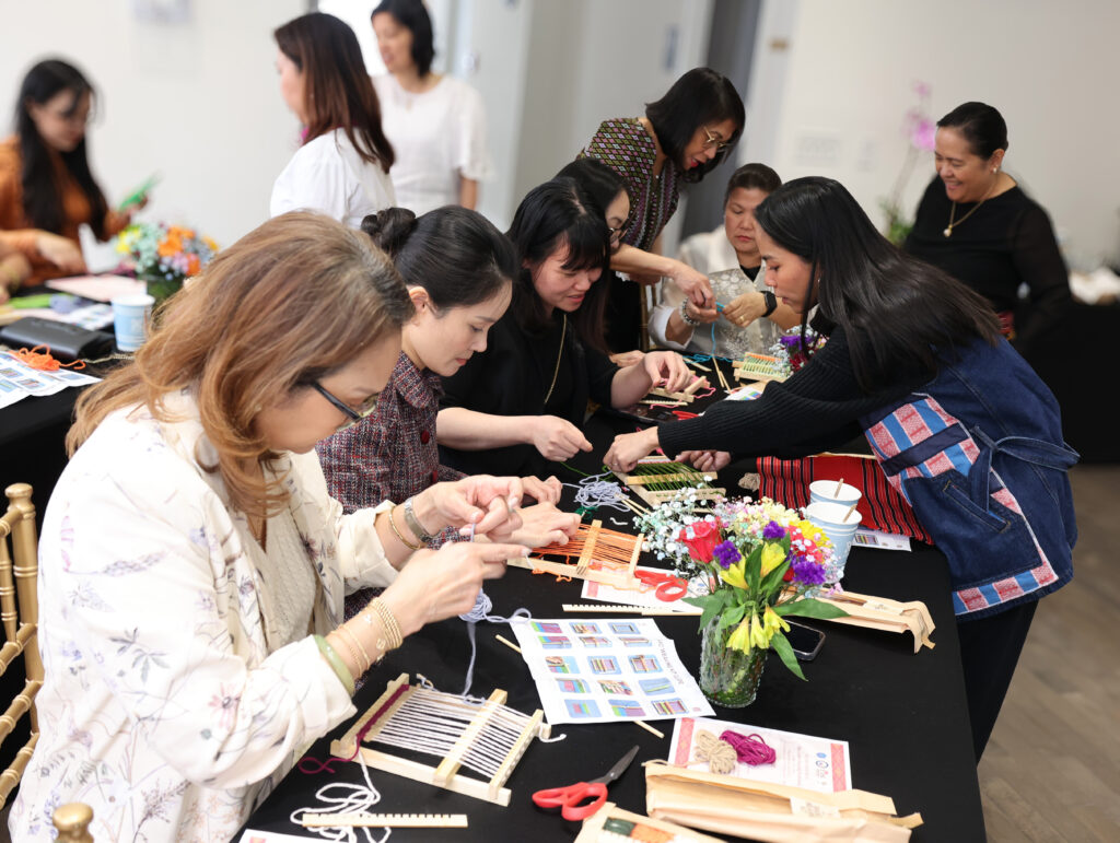 Spouses of the ASEAN Ambassadors in Washington, D.C., and other ASC members share a moment of creativity and camaraderie as they explore the relaxing and timeless art of weaving with their mini looms.