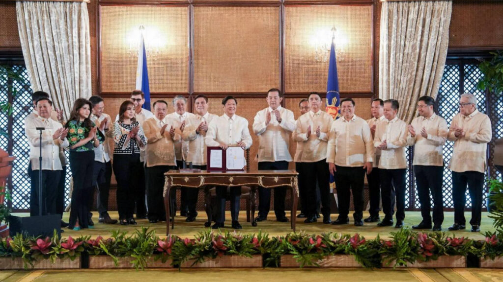 Philippine President Ferdinand Marcos Jr. (10th from left) accompanied by other Philippine officials during the signing of Republic Act No. 11982, or the Expanded Centenarians Act. (Photo by Asian Journal).