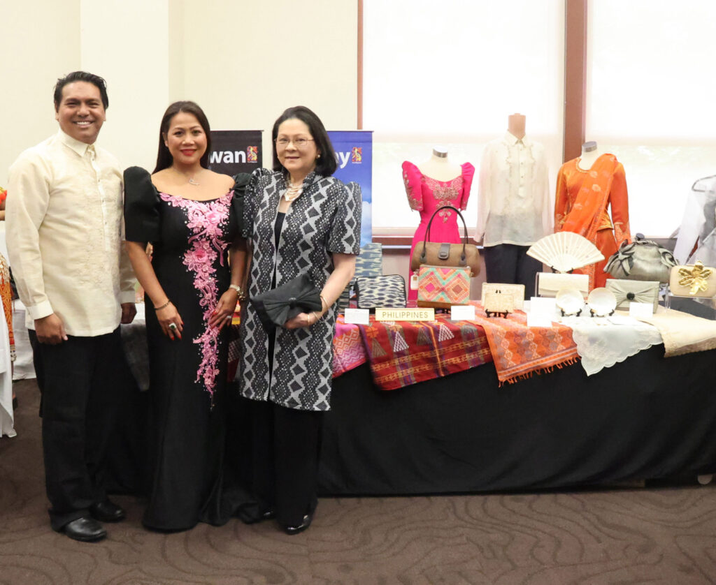 Mrs. Maria Lourdes Romualdez poses with the Philippine volunteer models at the Philippine booth for the ASEAN Couture event.