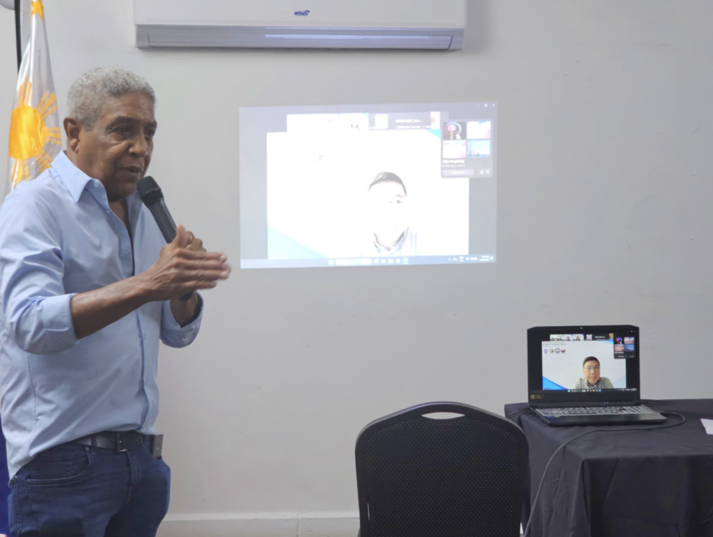 Honorary Consul Keith Russell delivers his opening remarks during the town hall meeting on 30 April 2025 in Kingston, Jamaica.