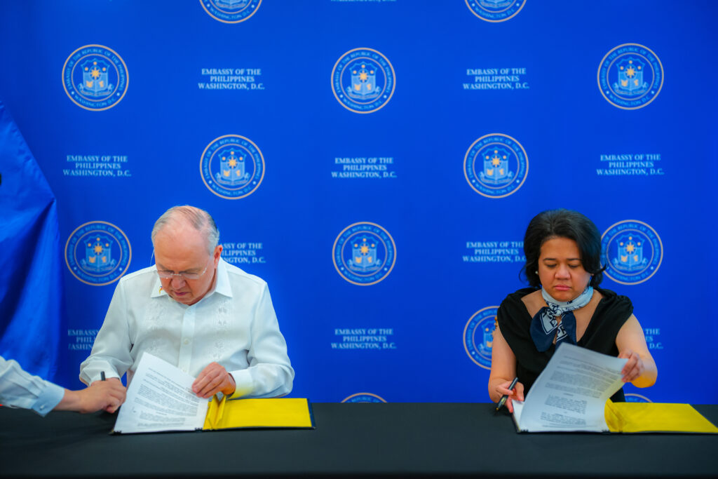 Ambassador Jose Manuel Romualdez and Ms. Licelle Cobrador sign the agreement between the Philippine Embassy and the Filipino American Legal Defense and Education Fund (FALDEF) at a ceremony held on 13 June 2025.