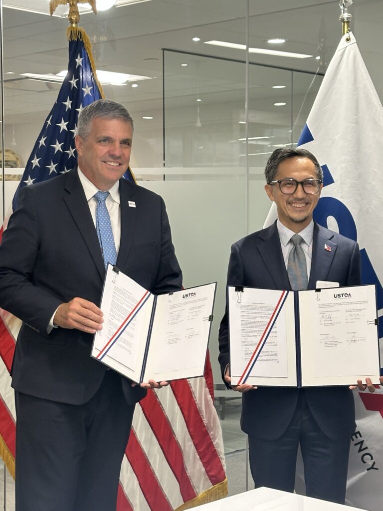 Secretary of Transportation Vivencio B. Dizon (right) and United States Trade and Development Agency Acting Director Thomas R. Hardy (left) sign a beneficiary agreement to help the DoTr develop a proposed 155-km. freight railway connecting Subic, Clark, Manila and Batangas.