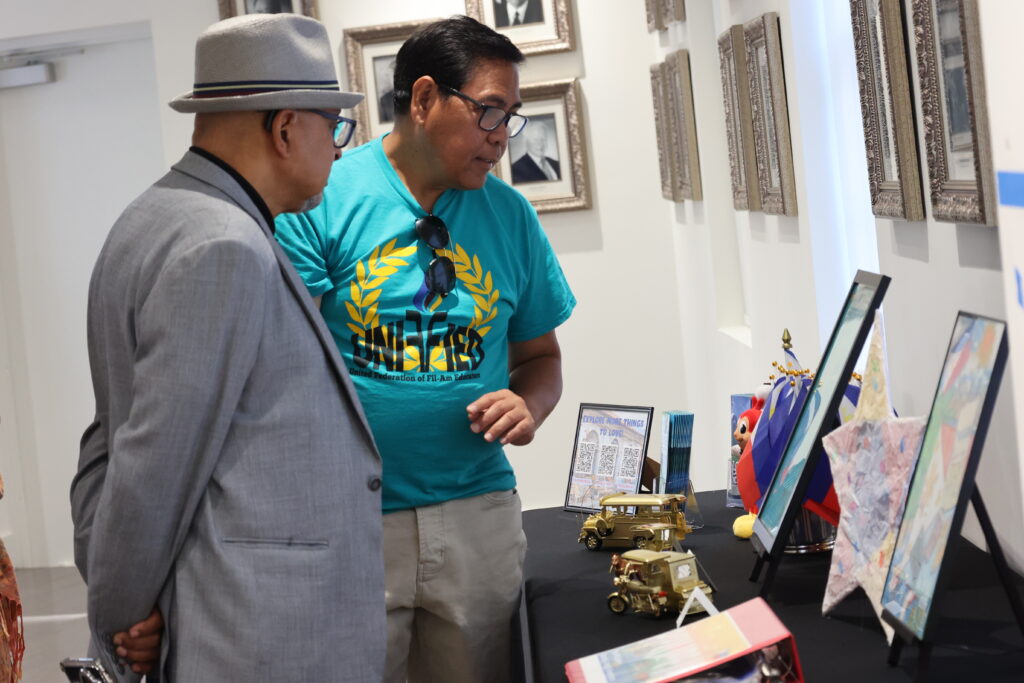 Participants browse the cultural displays featuring iconic elements of Filipino life and tradition.