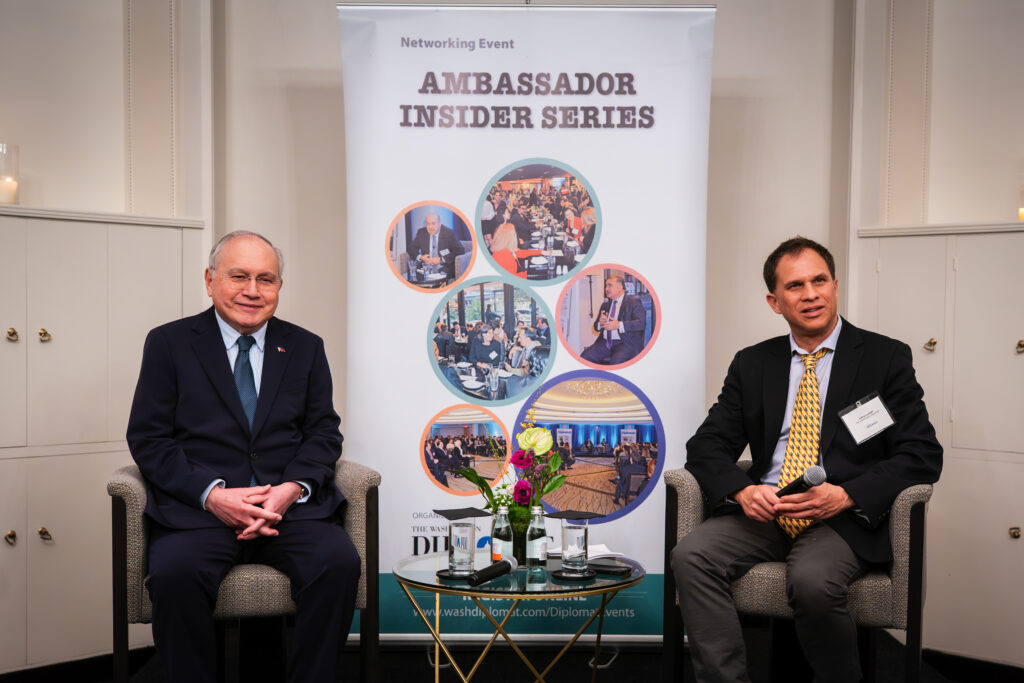 The discussion was moderated by Washington Diplomat news editor Larry Luxner (right).