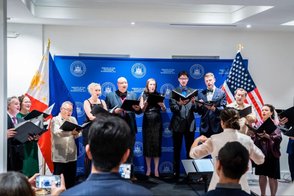 The Choral Arts ensemble sings Filipino and English Christmas carols at the Philippine Embassy during the Ambassador&rsquo;s Cocktail Reception held in honor of the partnership between the Philippine Embassy in Washington, D.C. and the Choral Arts Society of Washington.