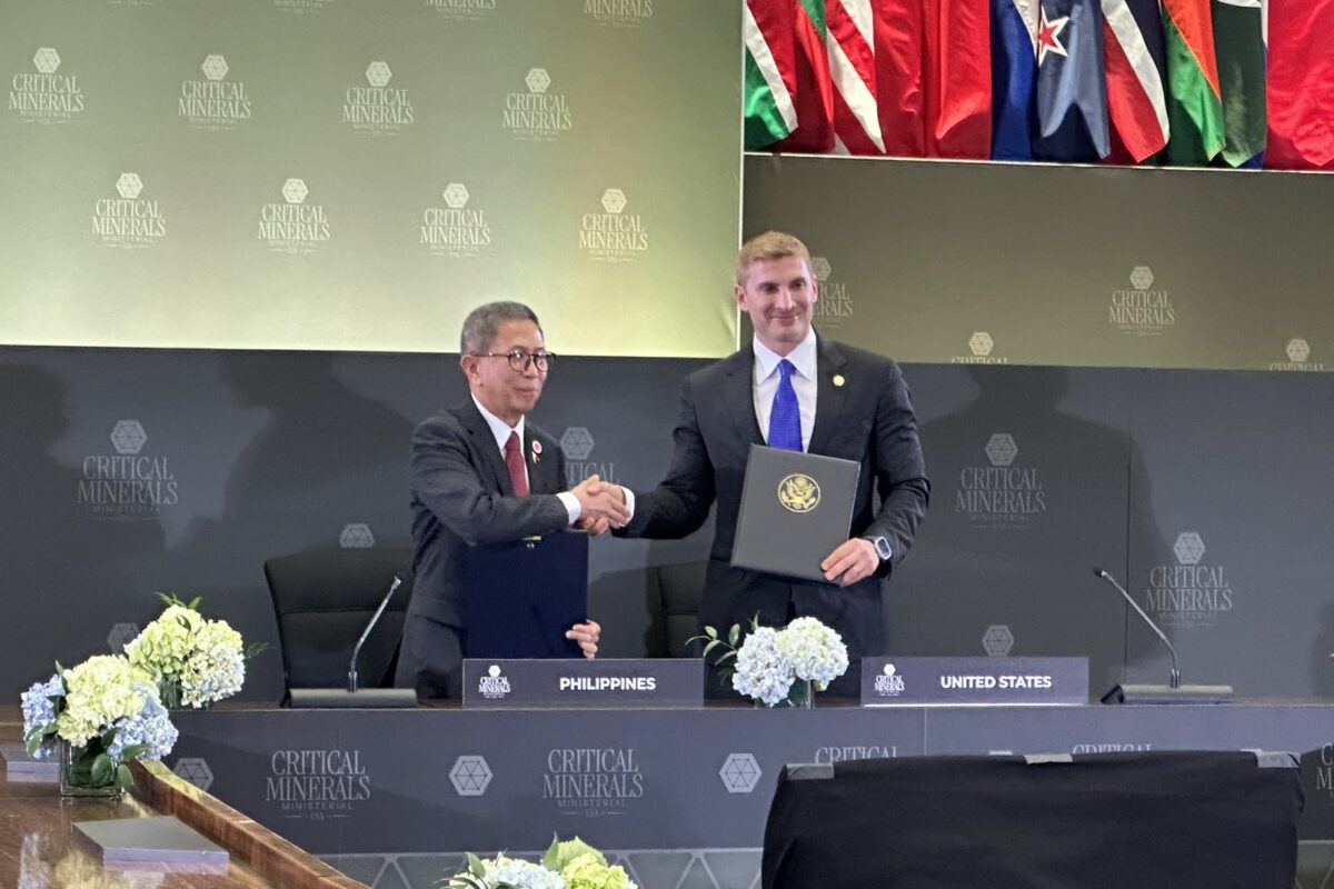 Hon. Raphael P.M Lotilla (left), Secretary of Environment and Natural Resources, and Hon. Jacob Helberg (right), Under Secretary of State for Economic Affairs, shake hands after the MOU signing.