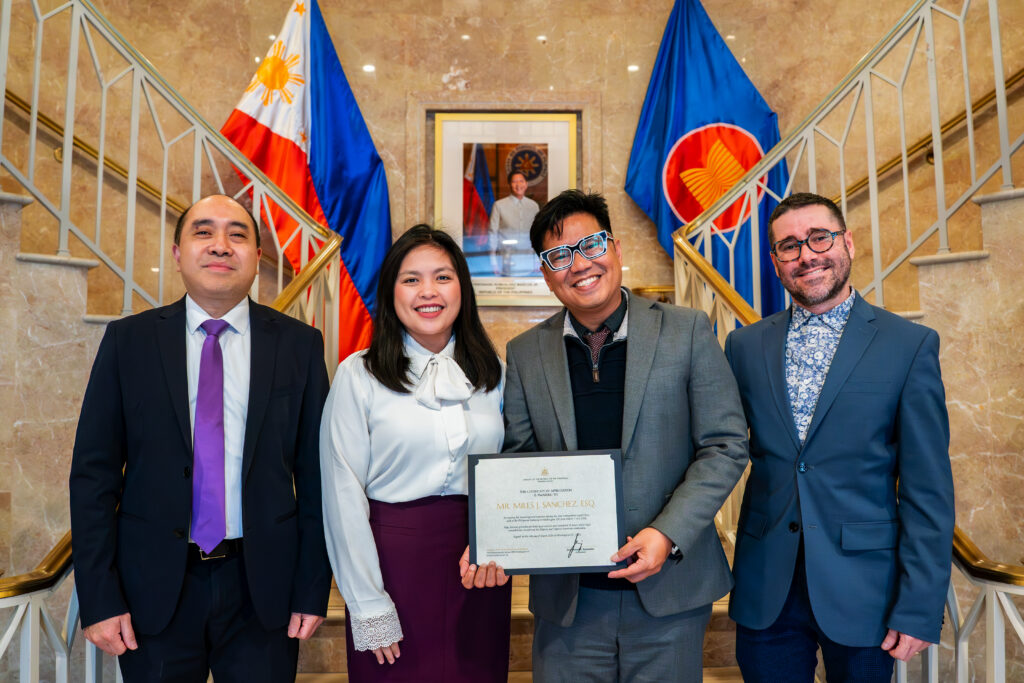 Atty. Miles Sanchez (third from left) receives a Certificate of Appreciation from Charg&eacute; d&rsquo;Affaires Felipe Cari&ntilde;o III (leftmost), and is joined by Consul Barbie Rosales (2nd from left) and Mr. Jonathas Alves (rightmost).