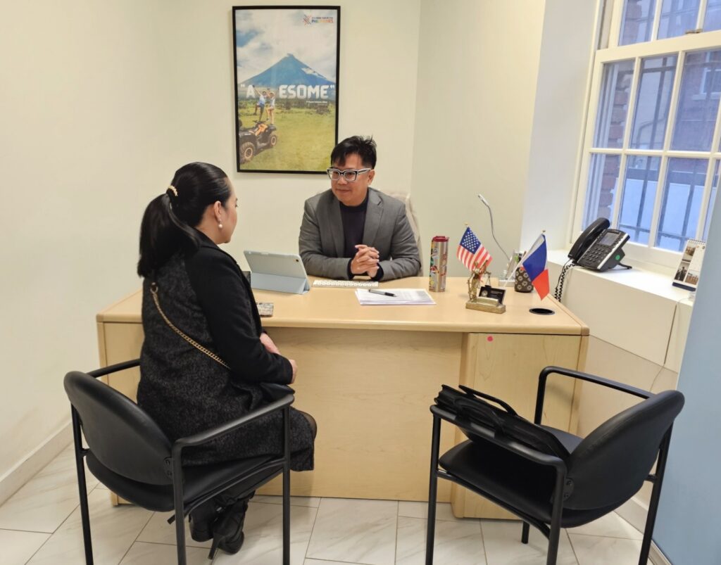 Atty. Miles Sanchez listens to a client, providing a safe space to discuss their immigration status.