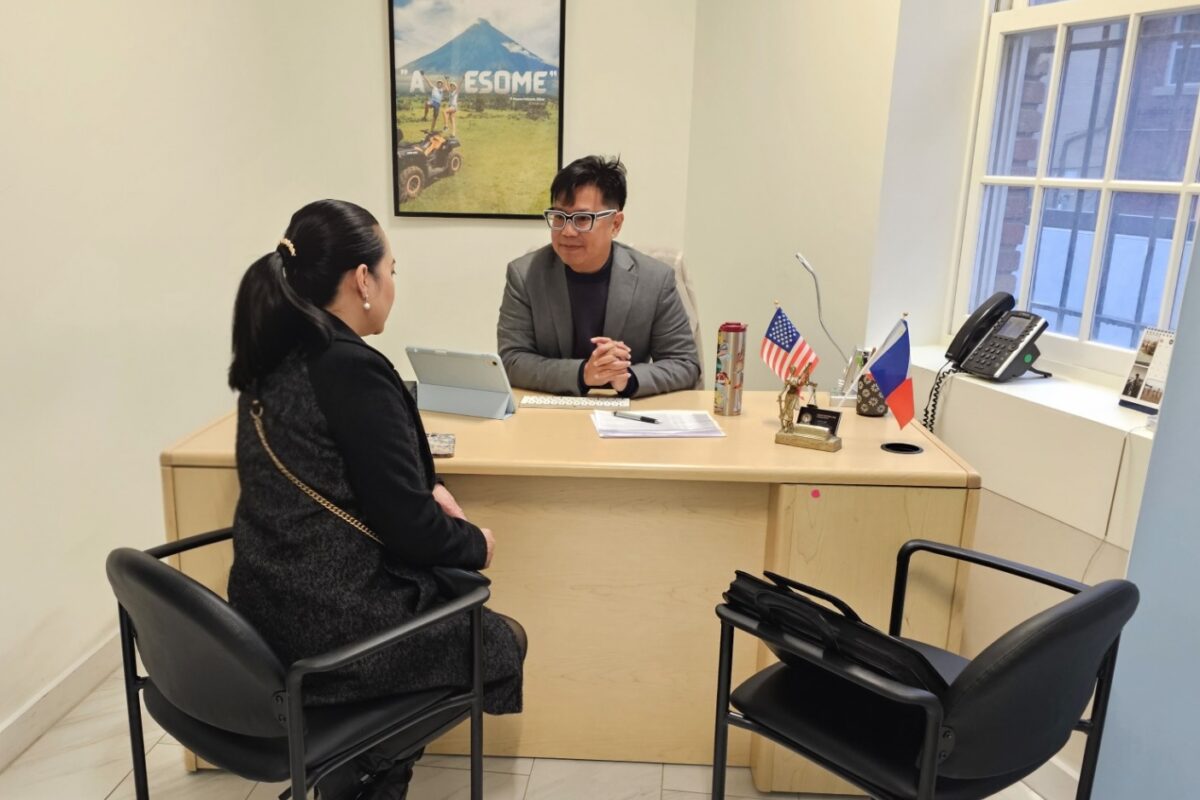 Atty. Miles Sanchez listens to a client, providing a safe space to discuss their immigration status.