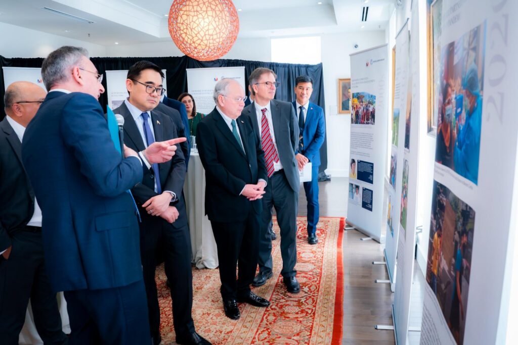 Mr. Zafer Mustafaoglu, WB Division Director for the PH, Malaysia, and Brunei (extreme left) explains the photo exhibit to Finance Secretary Go as Ambassador Romualdez and WB Vice President Jaramillo (2nd from right) look on.