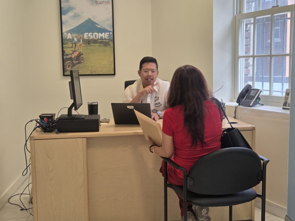 A client (right) consults with Atty. Dion Romano (left) on Philippine property law during a free legal aid clinic at the Philippine Embassy on 17 April 2026.