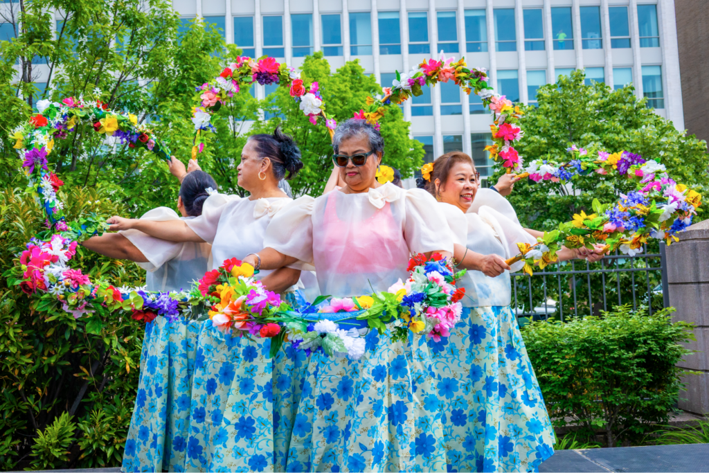 The Mabuhay, Inc. Dance Ensemble brought Filipino traditions to life with vibrant performances of Bulaklakan, a lively floral dance inspired by the Santa Cruz de Mayo festival, and Singkil, rooted in Maranao heritage, Singkil portrays a royal princess gracefully navigating an earthquake caused by forest spirits, as she moves between clashing bamboo poles with the aid of fans symbolizing wind and nature. The celebration continued beyond the stage, as guests joined in and tried Tinikling themselves, stepping into the rhythm and energy of one of the Philippines&rsquo; most beloved dances.