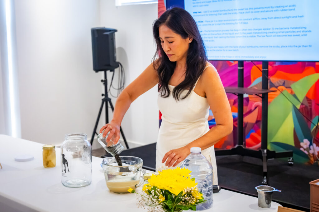 Ms. Tanya Maynigo, introduces participants to the history, fermentation process, and wellness benefits of kombucha during the workshop.