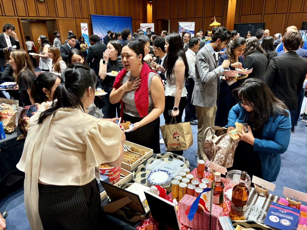 Guests visit the Philippine booth to sample food and learn about the country