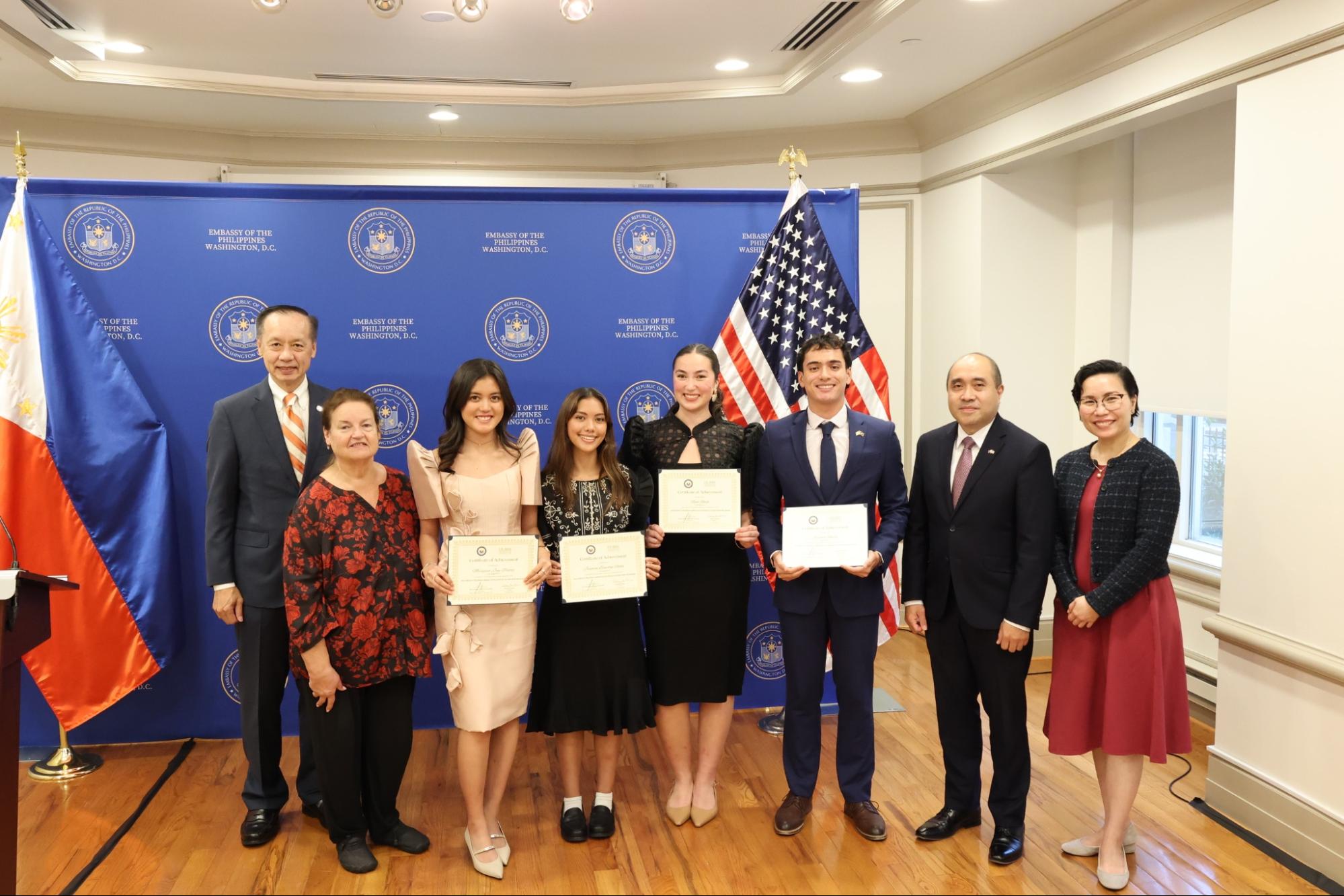 (L-R) US-Asia Institute (USAI) Vice Chairman Ben Wu, USAI President Mary Sue Bissell, 2026 IMPACT! fellows Margaret Jane Piatos, Jasmine Lianalyn Rocha, Reece Roach, and Spencer Smith, and the Embassy&rsquo;s Charg&eacute; d'Affaires Felipe F. Cari&ntilde;o III and Minister Lenna Eilleen C. De Dios-Sison at the conclusion of the graduation ceremony.