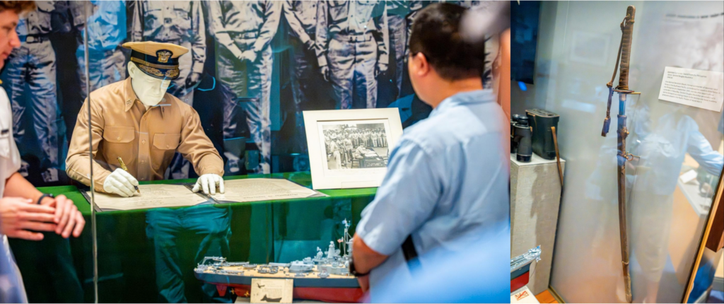 A display in the USNA Museum depicts the signing by Fleet Admiral Chester Nimitz of the Japanese Instrument of Surrender on 2 September 1945 aboard the USS Missouri. The display includes Admiral Nimitz&rsquo;s original uniform and paraphernalia used during the signing, as well as (inset) a Japanese sword surrendered to General Douglas MacArthur in a separate ceremony in the Philippines.
