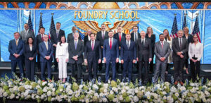 U.S. Vice President J.D. Vance (1st row, 6th from right), Secretary of State Marco Rubio (1st row, 6th from left), and Undersecretary of State Jacob Helberg (1st row, 5th from right) are joined by key university and business leaders during the launch of the Foundry School. (photo courtesy of the U.S. Department of State)