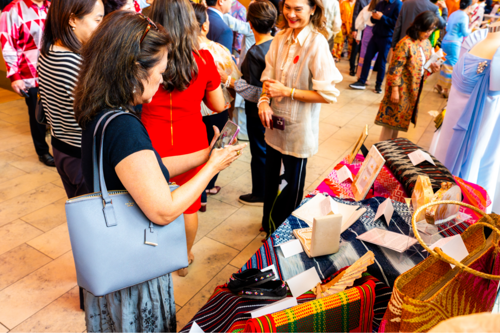 Guests stop by the Philippine booth to examine the displays and ask our curators about the stories and traditions represented in the exhibit.